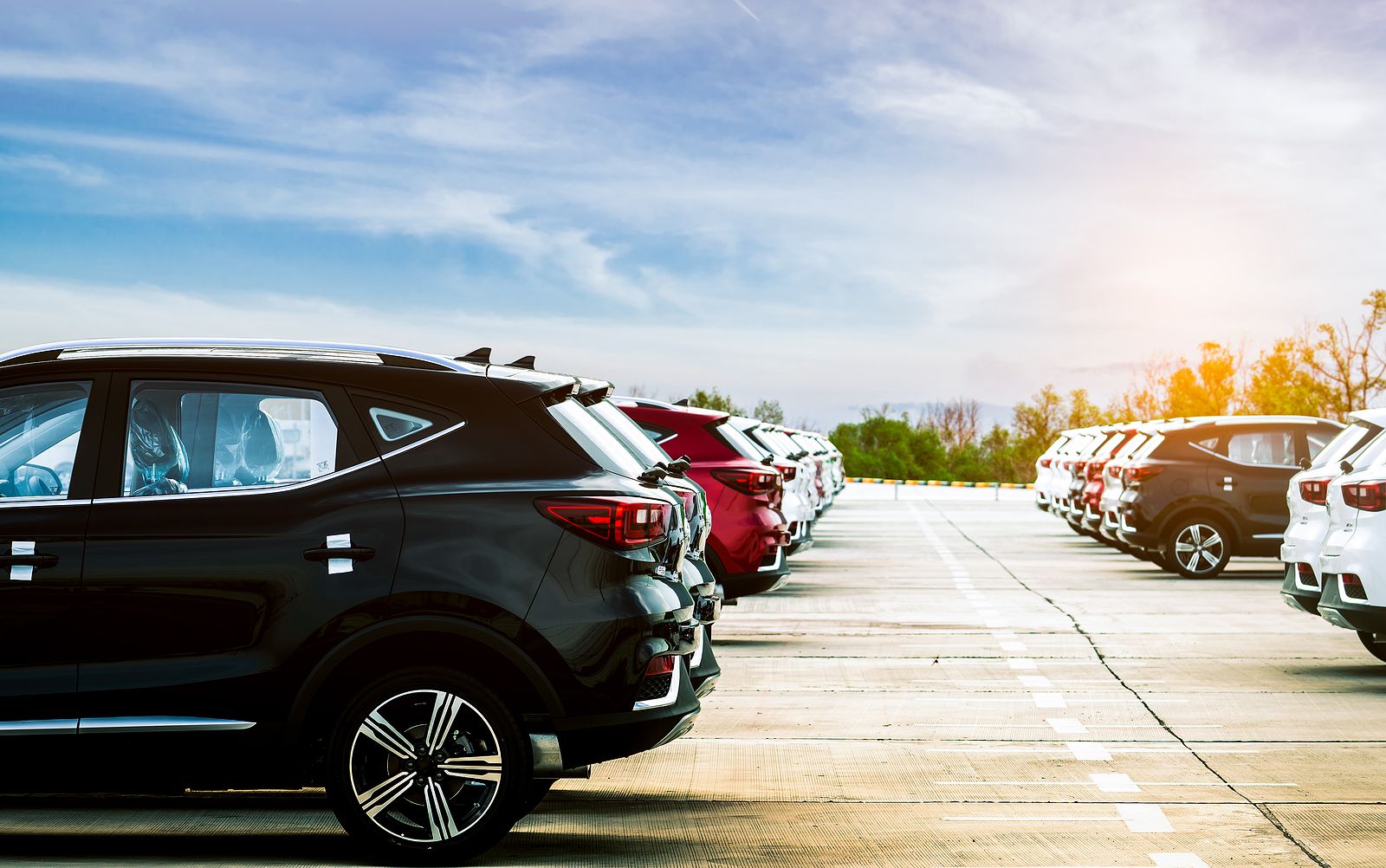 Row of vehicles under sky.